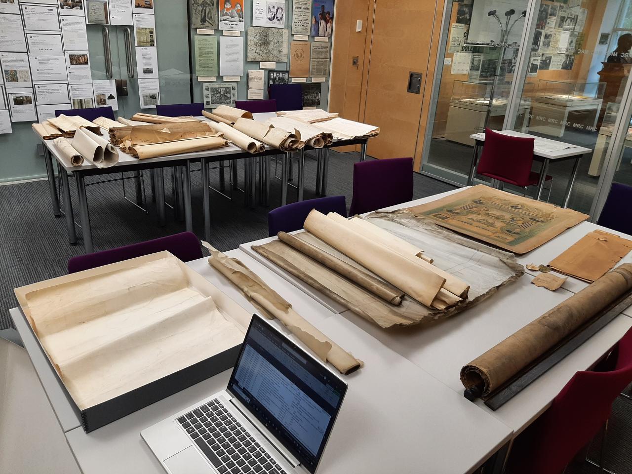 Plans and posters being catalogued at the Modern Records Centre.