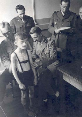 Allied officials examining a Hamburg schoolboy, 1946