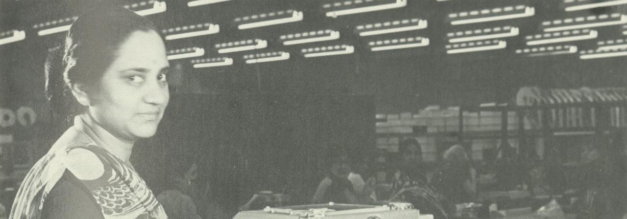 Image showing a woman manufacturing printed circuit boards at GEC, Coventry, in the early 1980s. She is of South Asian background and is wearing a sari.