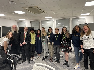 Photo of eleven people in a semi-circle facing the camera. These were the Books at November 2021 Human Library