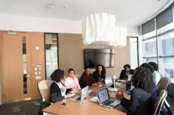 female colleagues around a work table