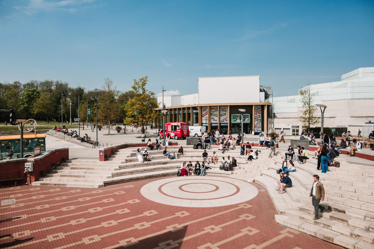 Piazza thriving with people on a sunny day