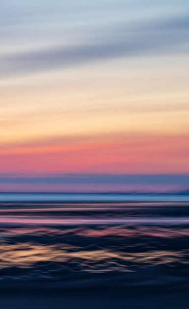 Photosgraph of a colourful sunset sky over the Irish Sea from a beach on the Lancashire coast 