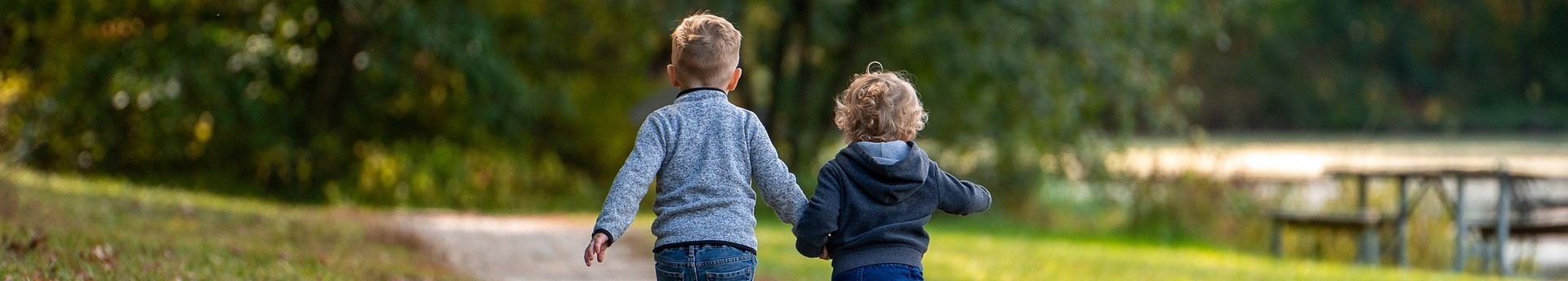 Children walking and holding hands 