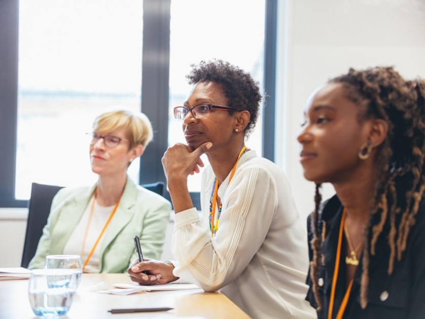 Delegates listening to a conference session