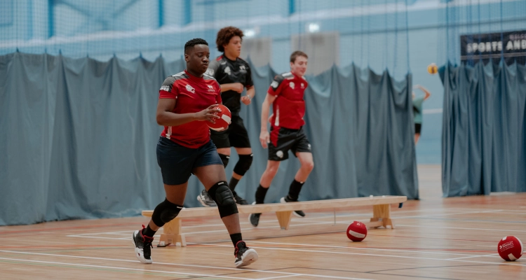 Playing dodgeball inside the sports and wellness hub