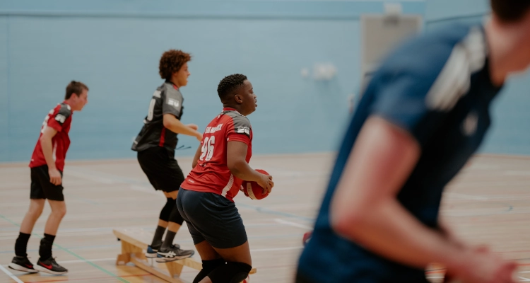 Playing dodgeball inside the sports and wellness hub