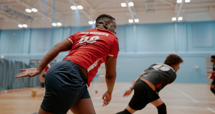 Playing dodgeball inside the sports and wellness hub
