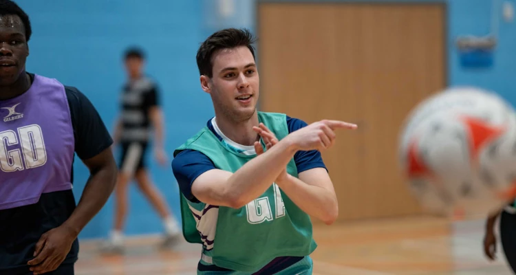 person throwing a netball