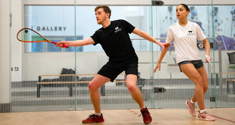 two people playing squash