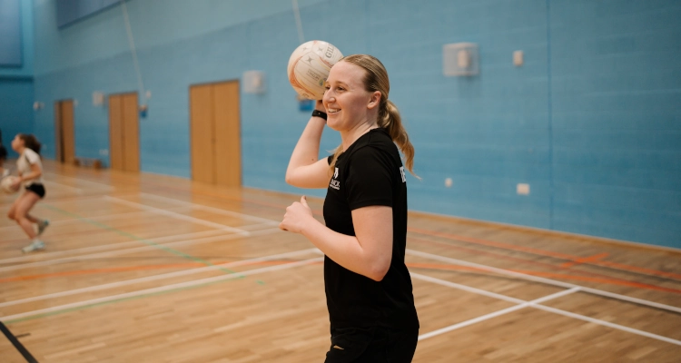 Tori Fisher playing netball in the Sports & Wellness Hub