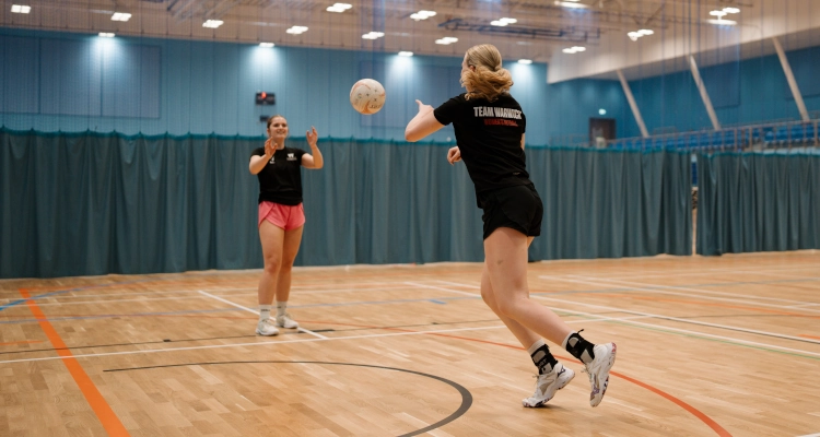Tori Fisher playing netball in the Sports & Wellness Hub