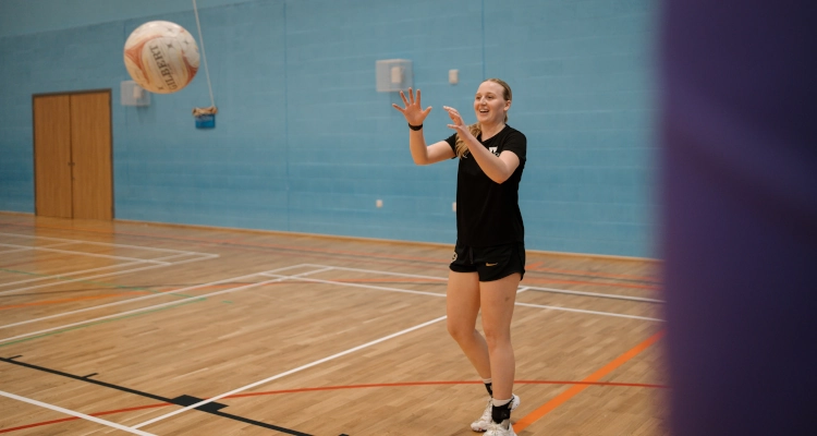 Tori Fisher playing netball in the Sports & Wellness Hub