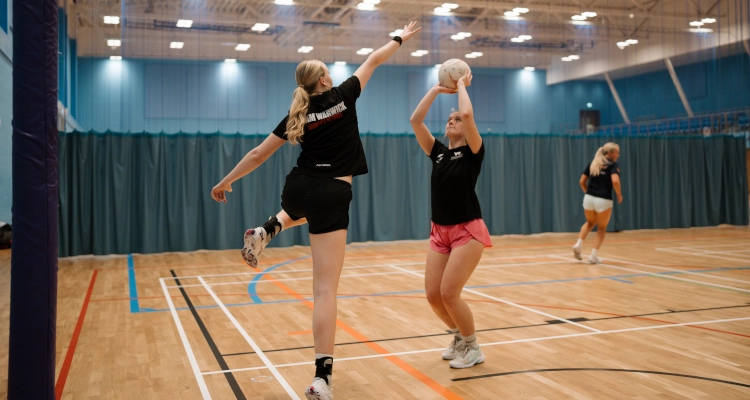 Tori Fisher playing netball in the Sports & Wellness Hub