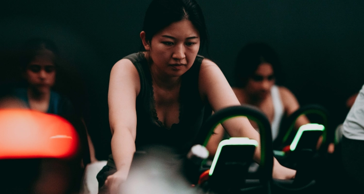 Woman cycling in the studio at the sports and wellness hub