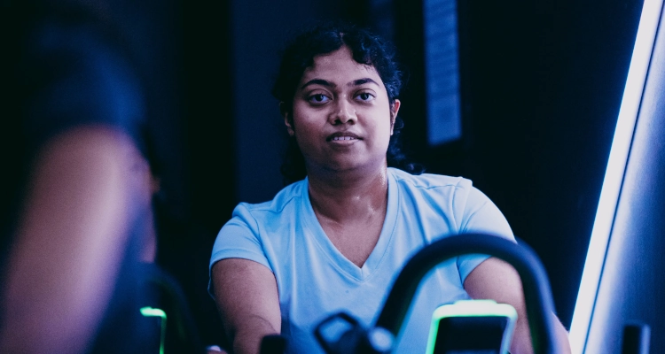 Woman cycling in the studio at the sports and wellness hub
