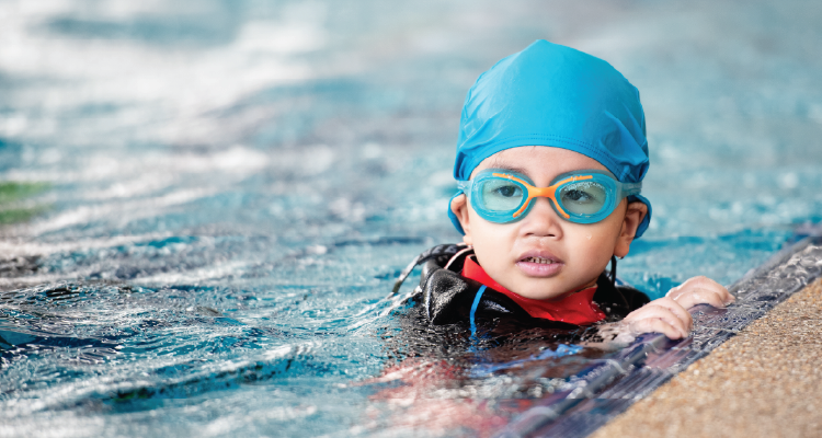 A child learns how to swim.