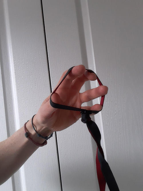 Hand stretching out elastic bands