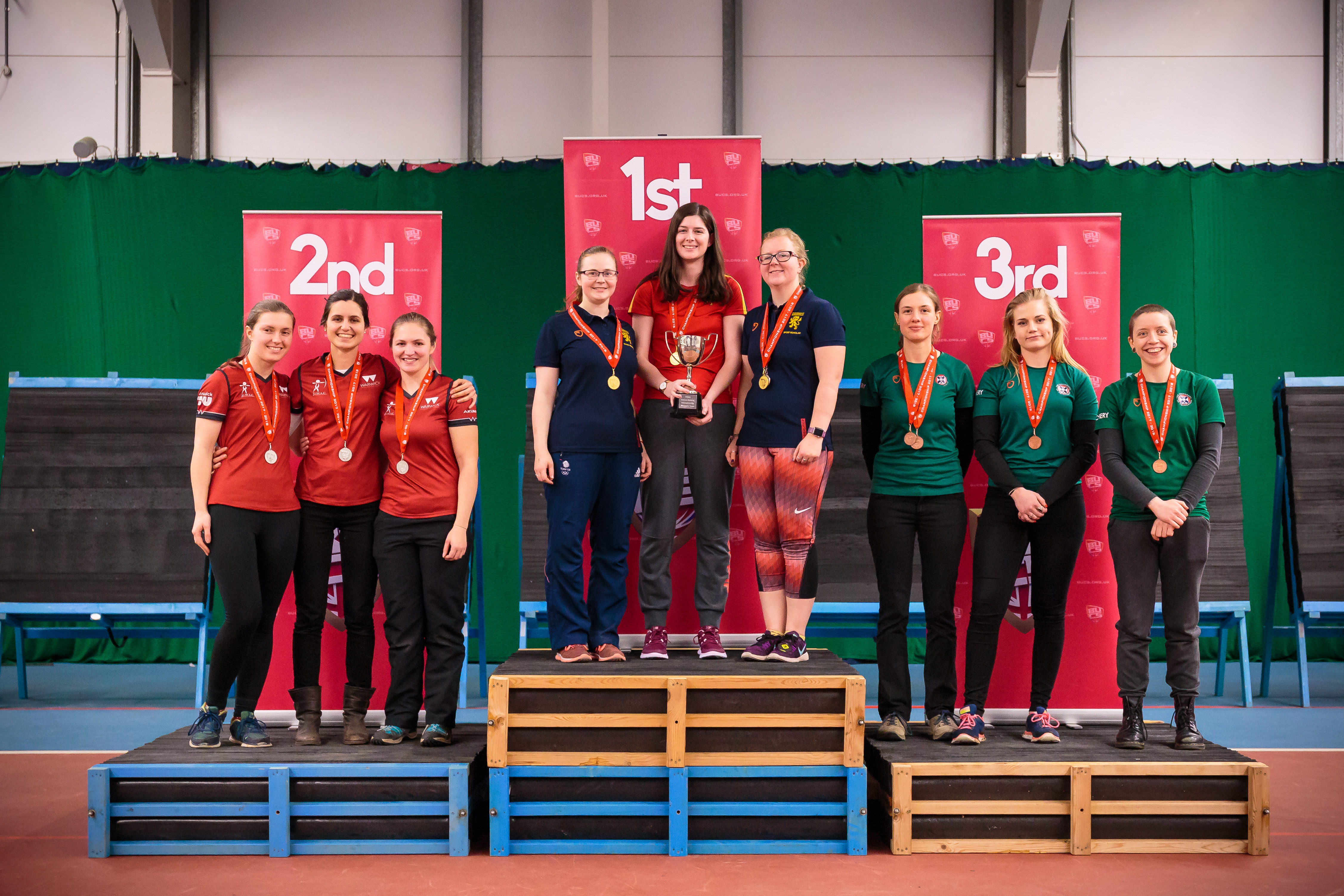 archers on medal podiums