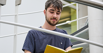 A student reading a book