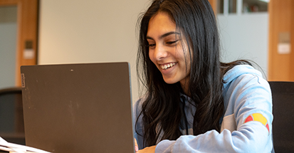 A student using a laptop