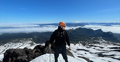 A student on top of a mountain