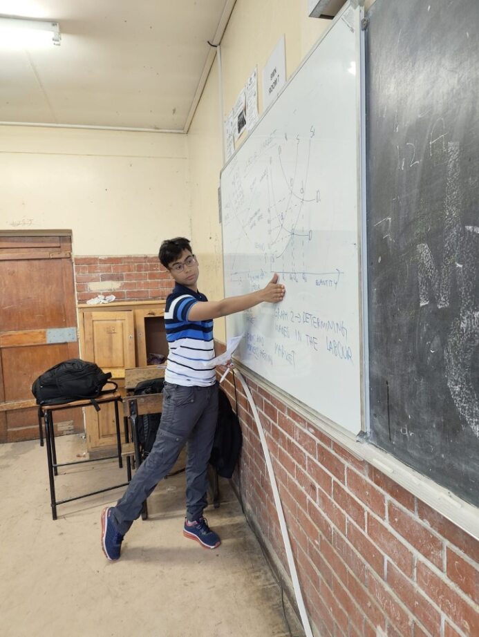 Aryamoy teaching in a classroom