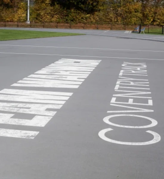 Team Warwick Coventry branding on the athletics track