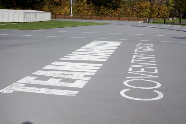 Team Warwick logo on athletics running track