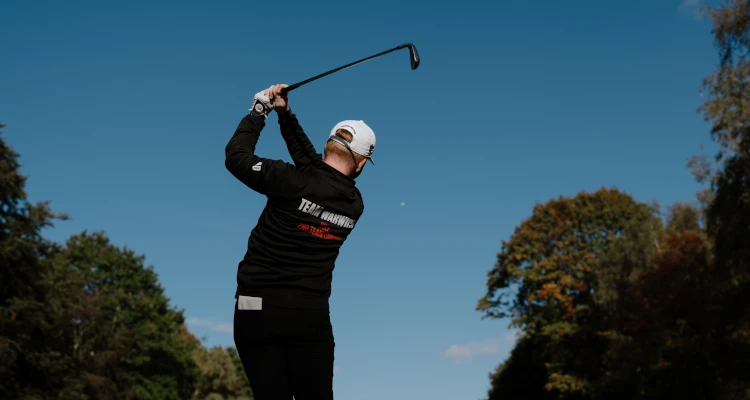 Arthur Duke playing a round of Golf