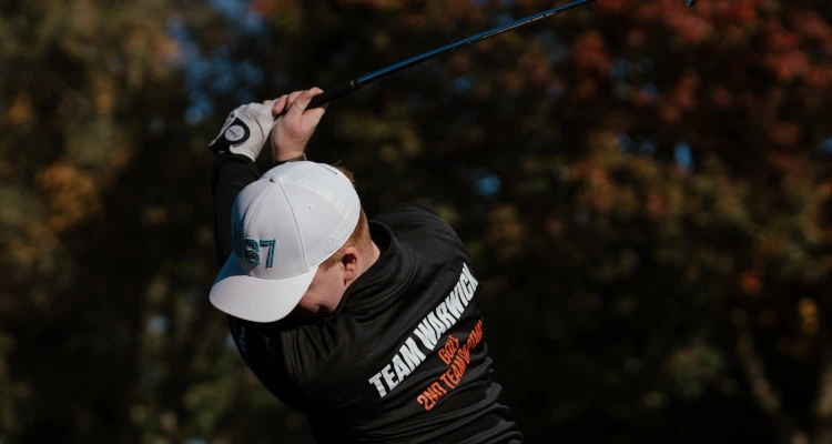 Arthur Duke playing a round of Golf