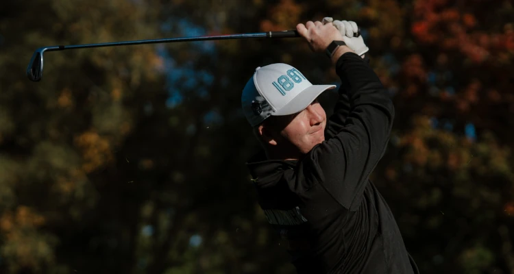 Arthur Duke playing a round of Golf