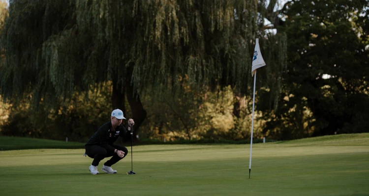 Arthur Duke playing a round of Golf