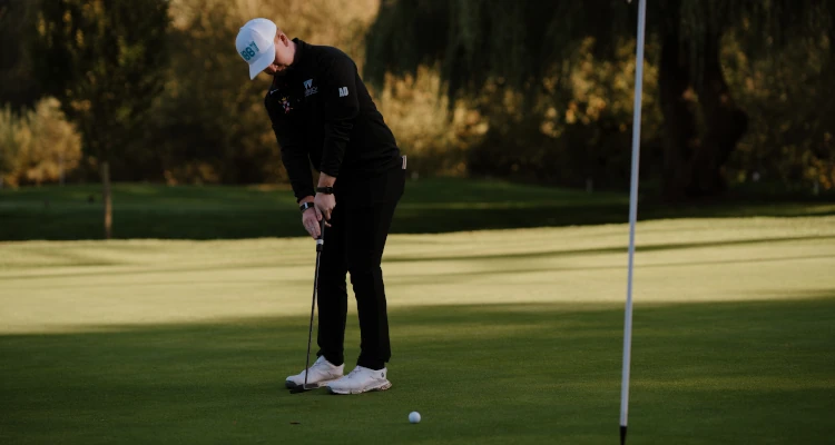 Arthur Duke playing a round of Golf