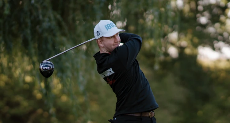 Arthur Duke playing a round of Golf