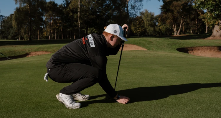 Arthur Duke playing a round of Golf