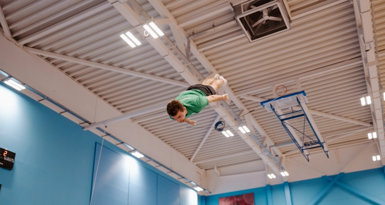 Dan Smith performing on a trampoline