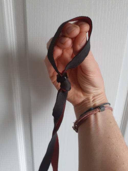 Hand with elastic bands round fingers