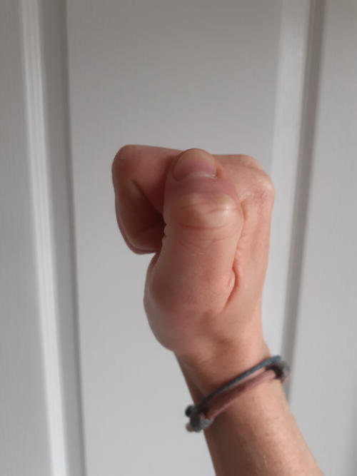 Hand making a full fist