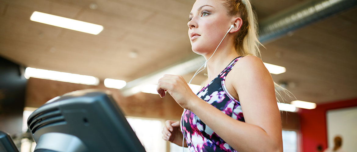 Woman on a running machine in the gym