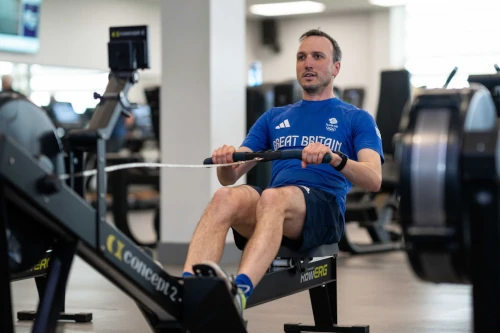 photo of a man using a rowing machine