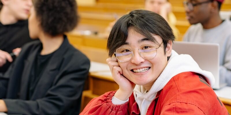 Asian student smiling at the camera