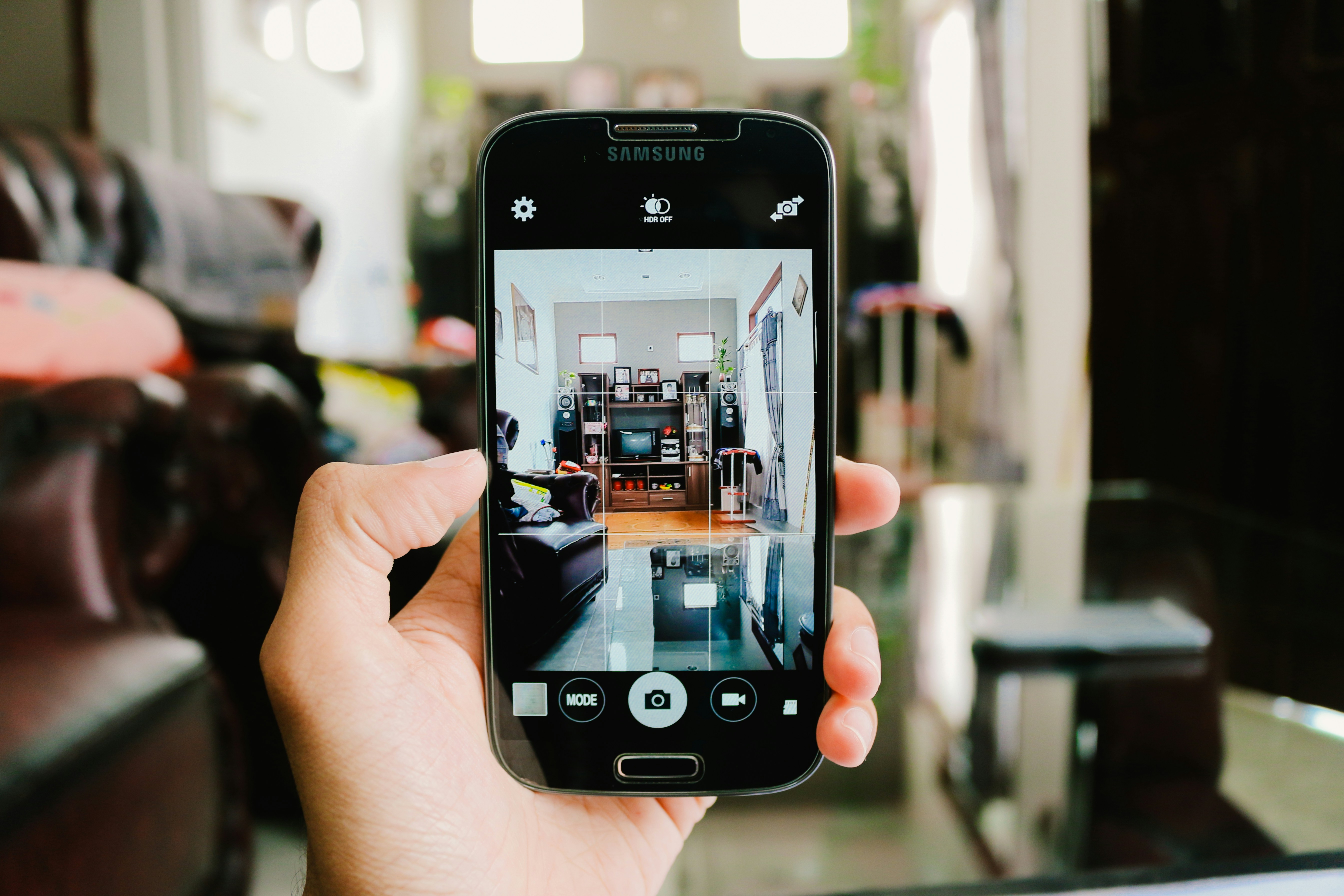 A person taking a picture of inside their house