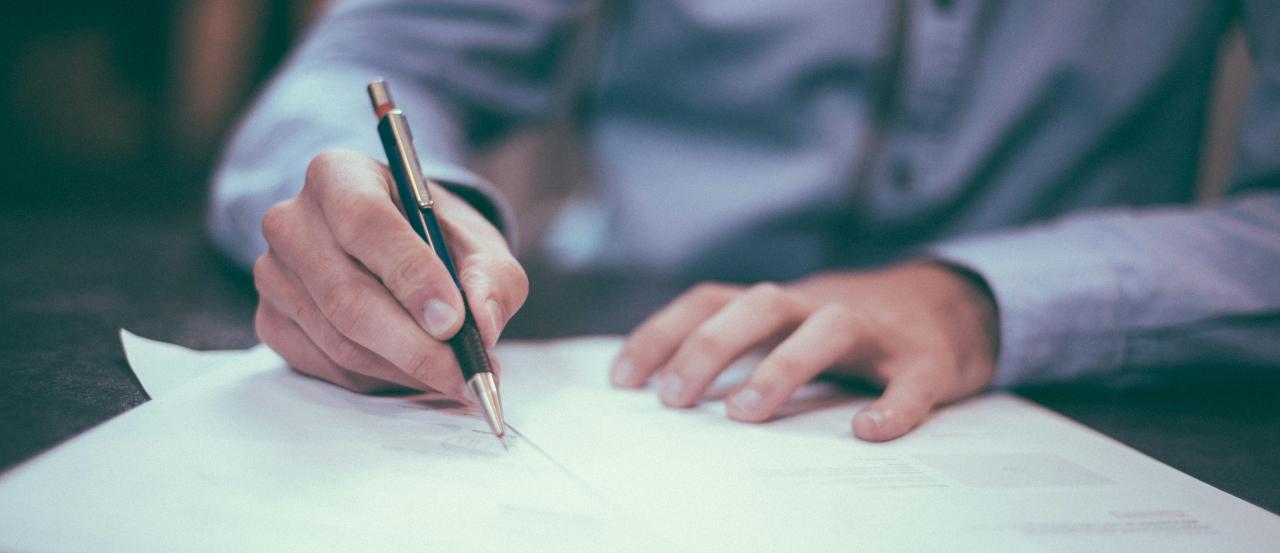 A person signing a contract