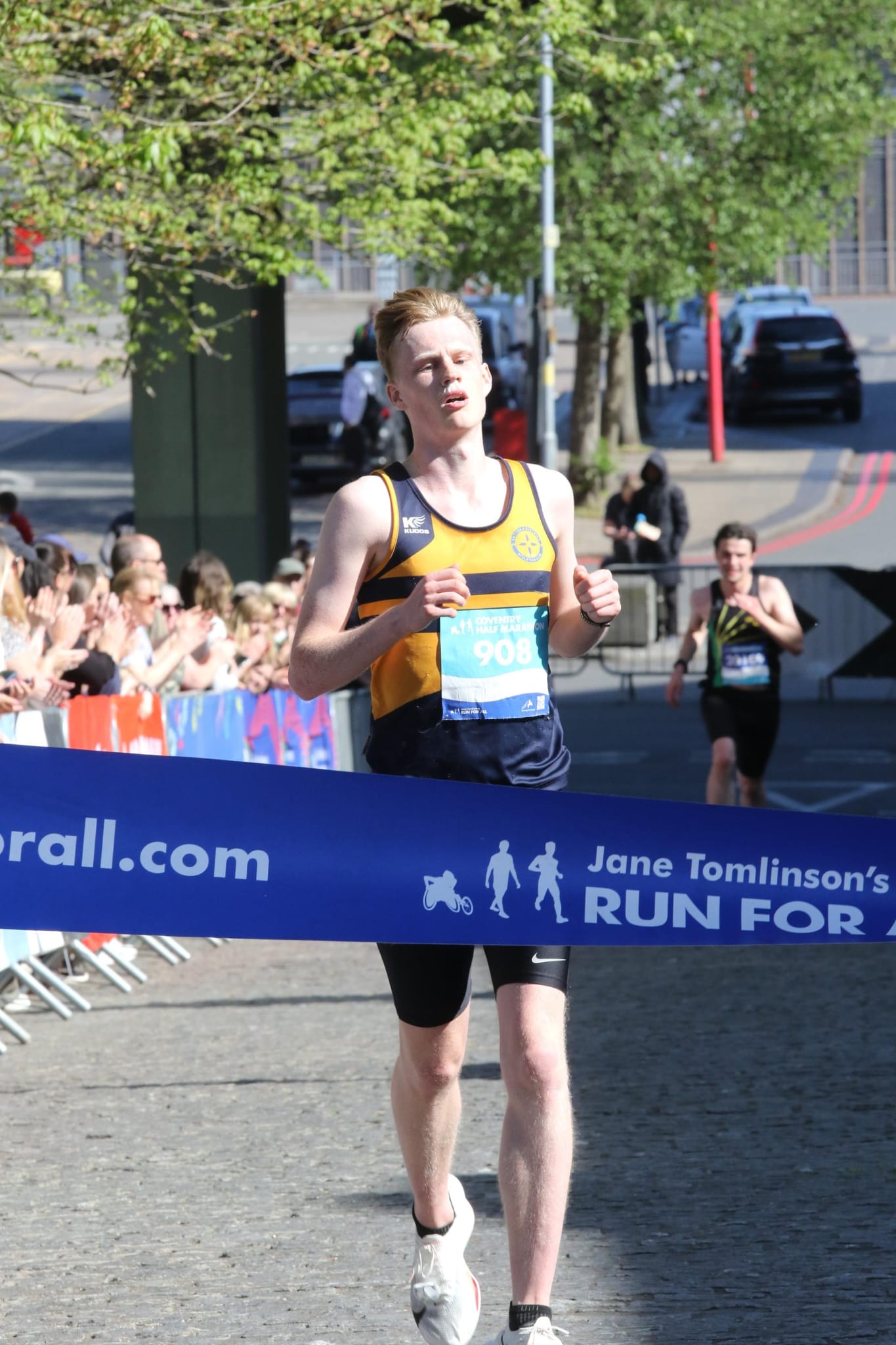 Adam crossing the finish line
