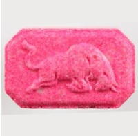 A picture of a red pill with 8 sides and a stamp of a bull on the front