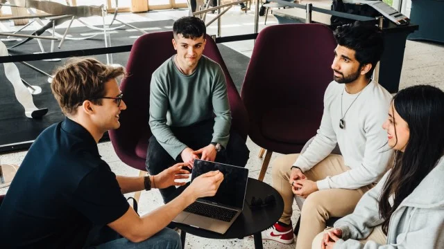 Students sitting having a discussion.