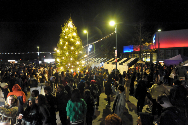 The Christmas Market on the Piazza, with a Christmas tree sparkling in the mid ground