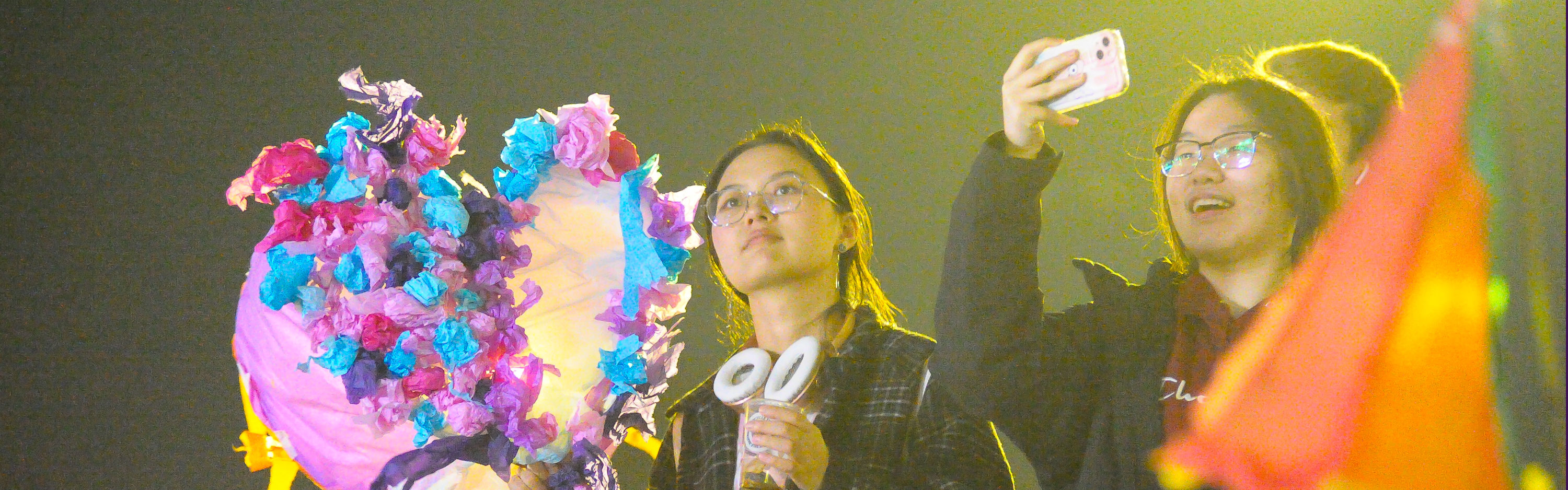 Two students at the Global Lights Procession holding lanterns, November 2024