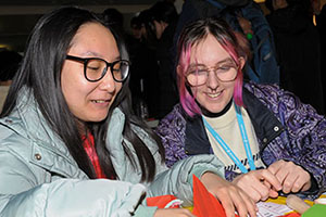 Students enjoying paper crafts at a previous Lunar New Year event